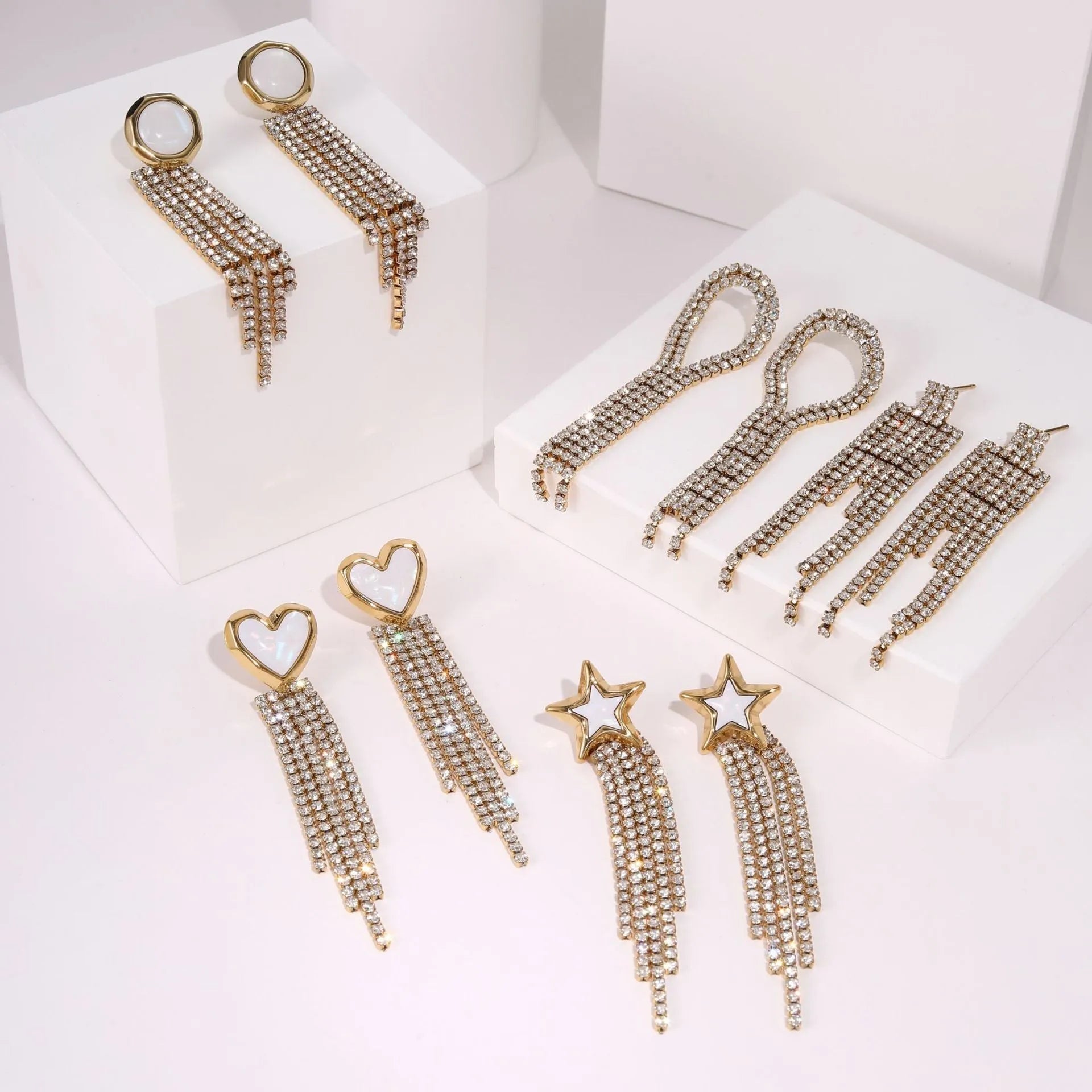 Stainless steel heart-shaped earrings with geometric star detailing and 18K gold electroplated finish