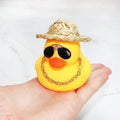 Yellow cartoon duck car ornament with straw hat and adhesive mounting kit