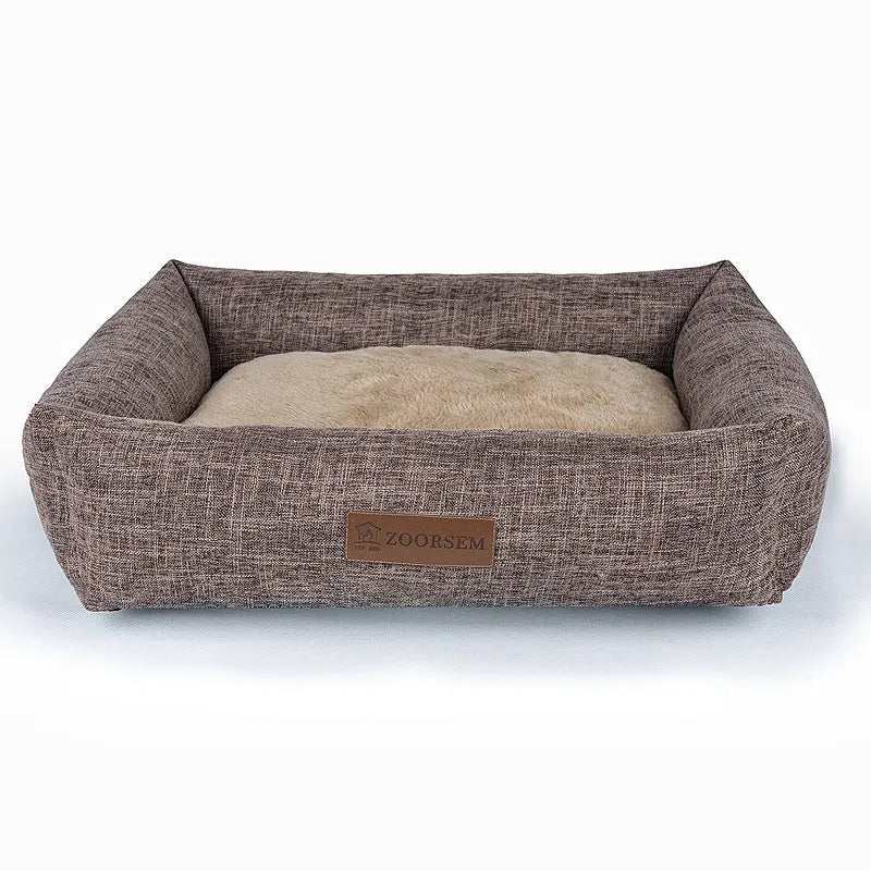 Grey plaid linen square dog bed for medium-sized dogs on a wooden floor.