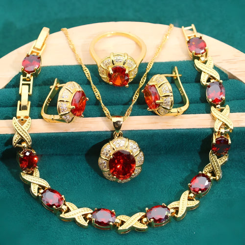 18k gold plated zircon jewellery set showing necklace, earrings, bracelet, and ring with sparkling cubic zirconia stones