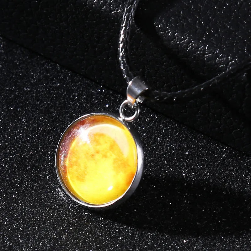 Luminous moon and constellation design pendant on an alloy necklace chain with extension.