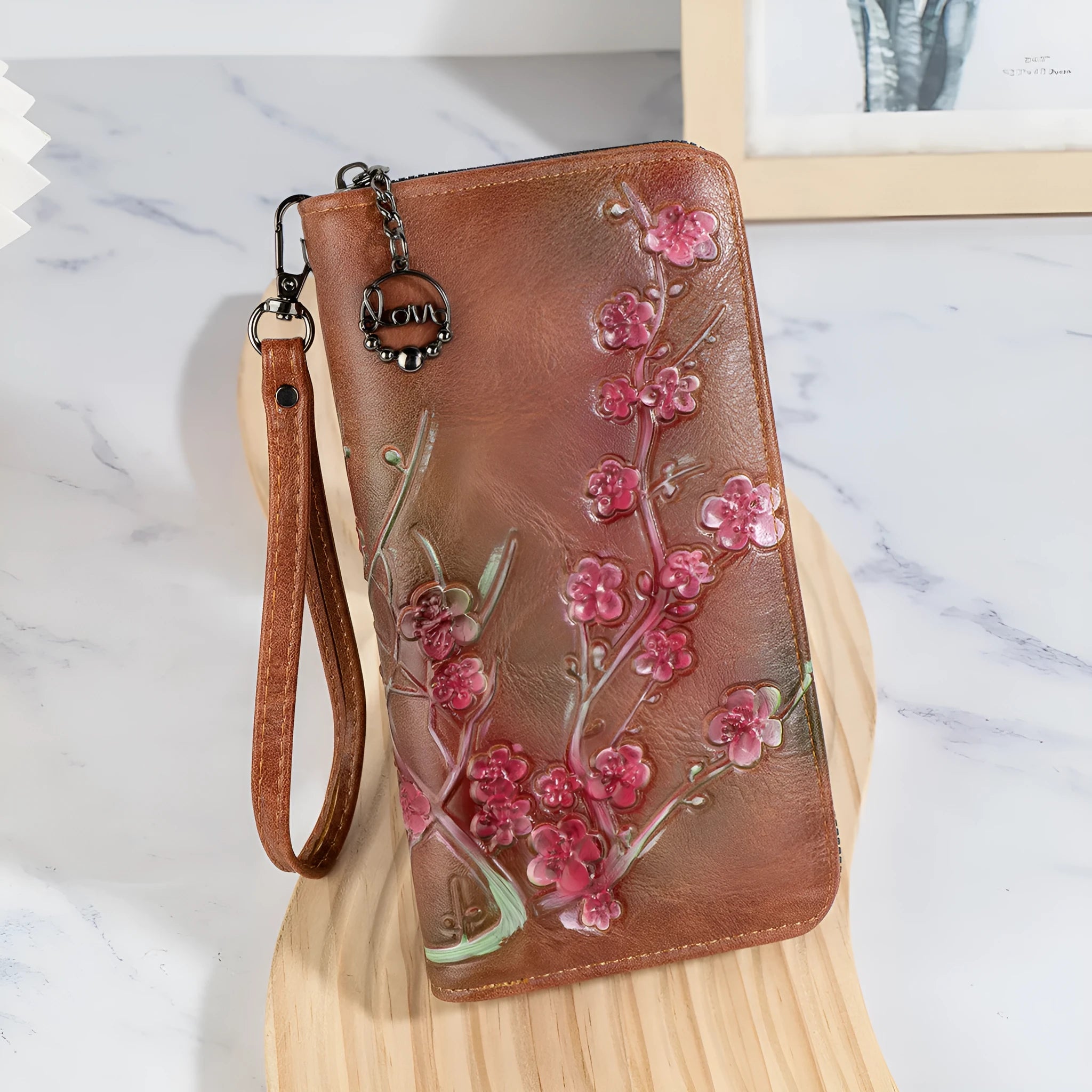 Embossed Chinese style handbag with floral pattern and zipper closure in black colour