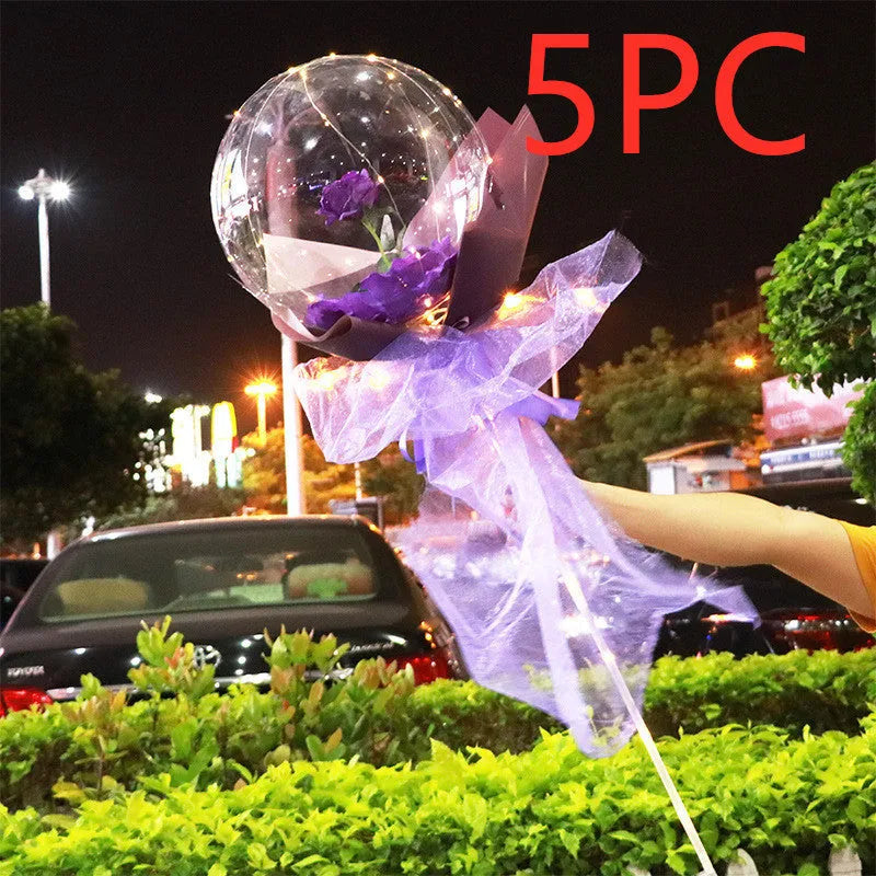Transparent LED luminous balloon with artificial rose and built-in light, shown as a DIY bouquet kit.