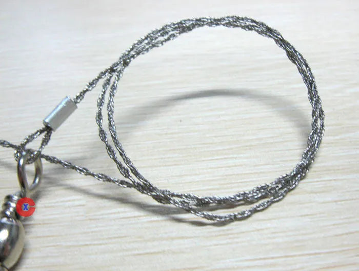 Survival wire saw with stainless steel blade and finger loops, showing 55cm length and pull ring