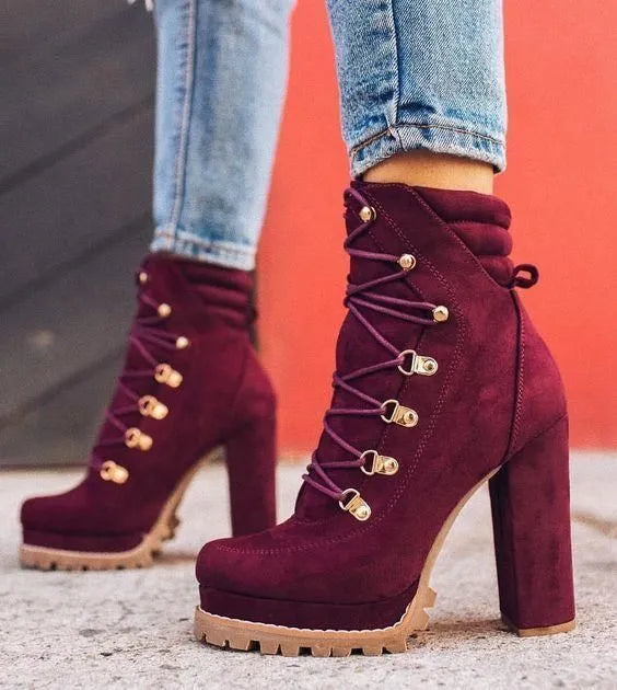 Women's suede ankle boots with thick heel in Roman style, showing decorative rivets and available in four colours