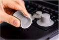 Four grey plastic laptop cooling pads: two large and two small, on a flat surface.