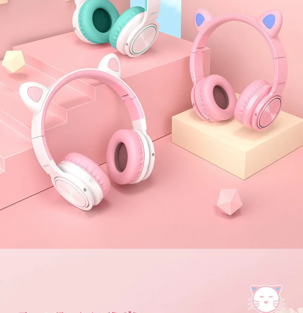 Pink white Bluetooth wireless over-ear headphones with braided cable and built-in microphone