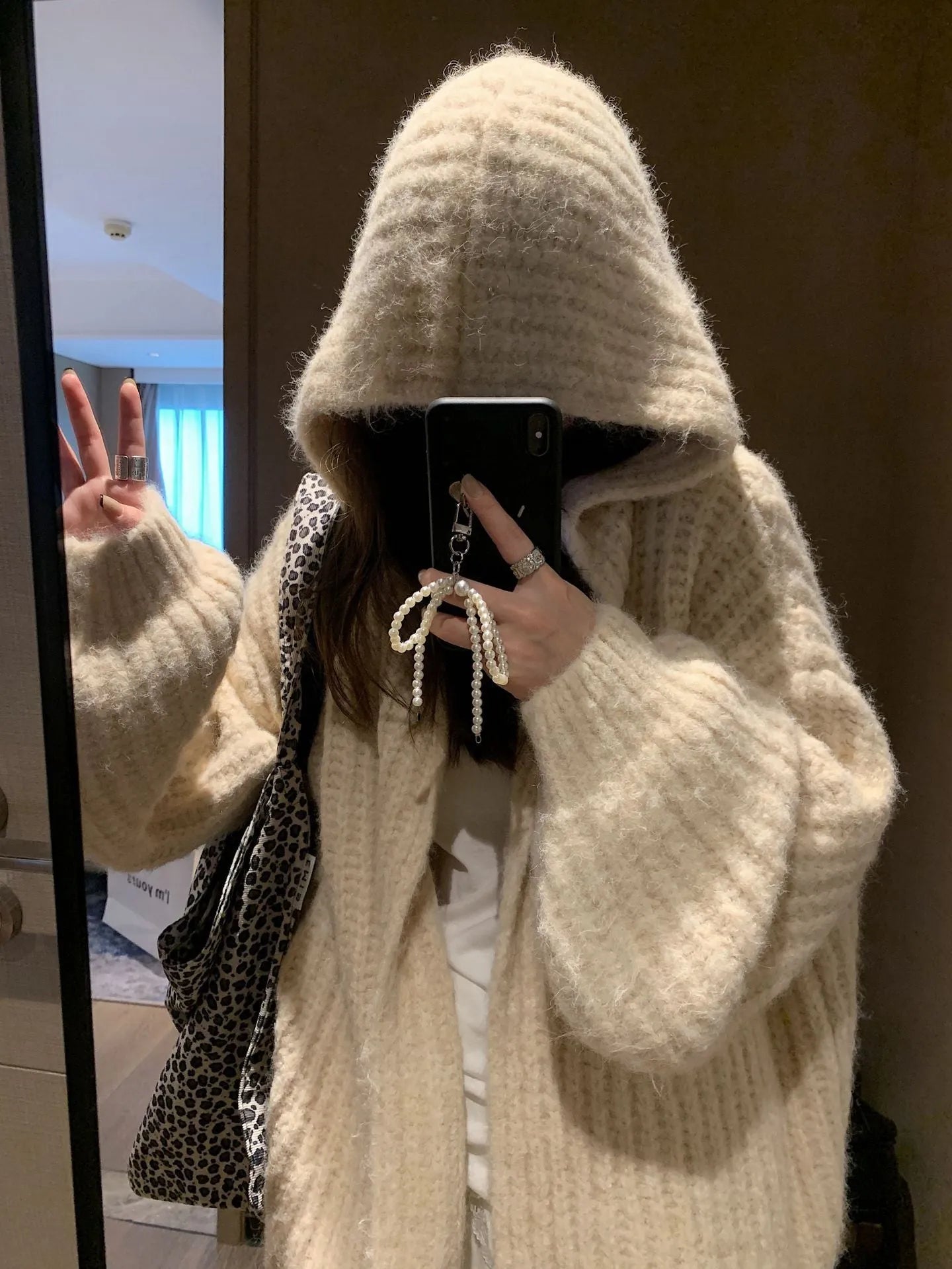 Women's loose fit hooded cardigan in thick acrylic fabric, shown in brown, dark grey, and milky white colour options