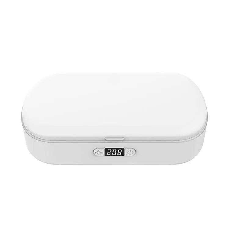 White portable UV steriliser and wireless charging box with aromatherapy function on a desktop