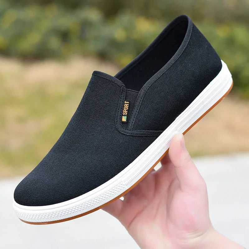 Men's black and blue canvas slip-on shoes with round toe design and composite soles
