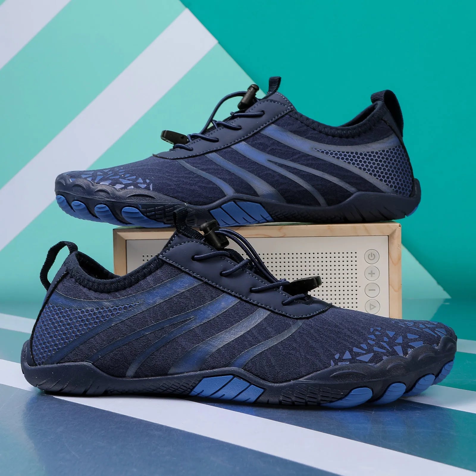 Lycra stretch fabric casual running shoes for men and women on a beach background.