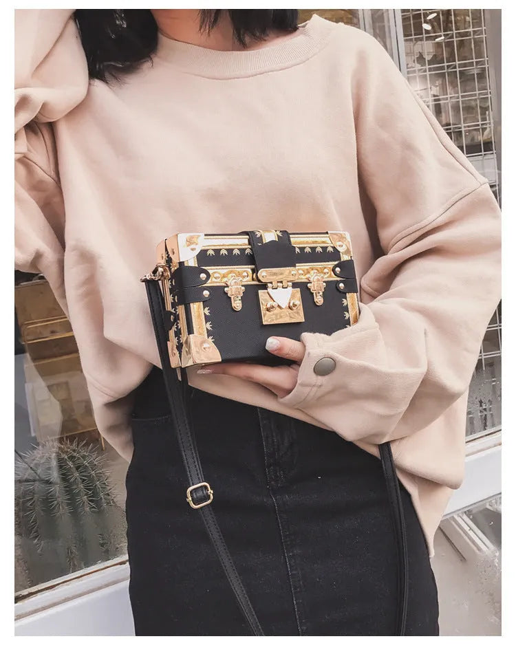 Hard-case women's shoulder bag with flap design, rivet decoration, and adjustable crossbody strap