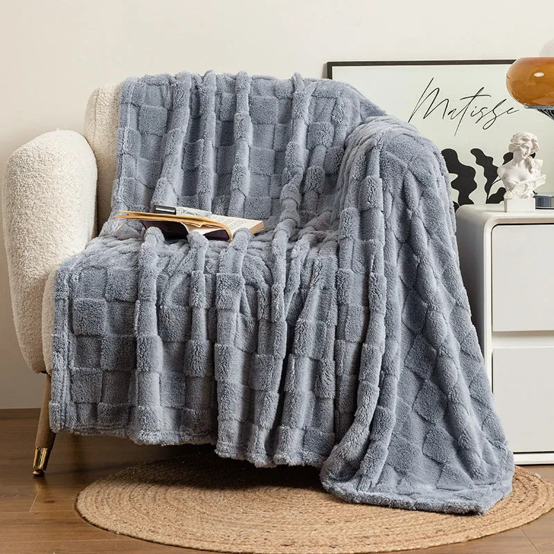 Geometric pattern polyester blanket in milky white colour showing thickened texture