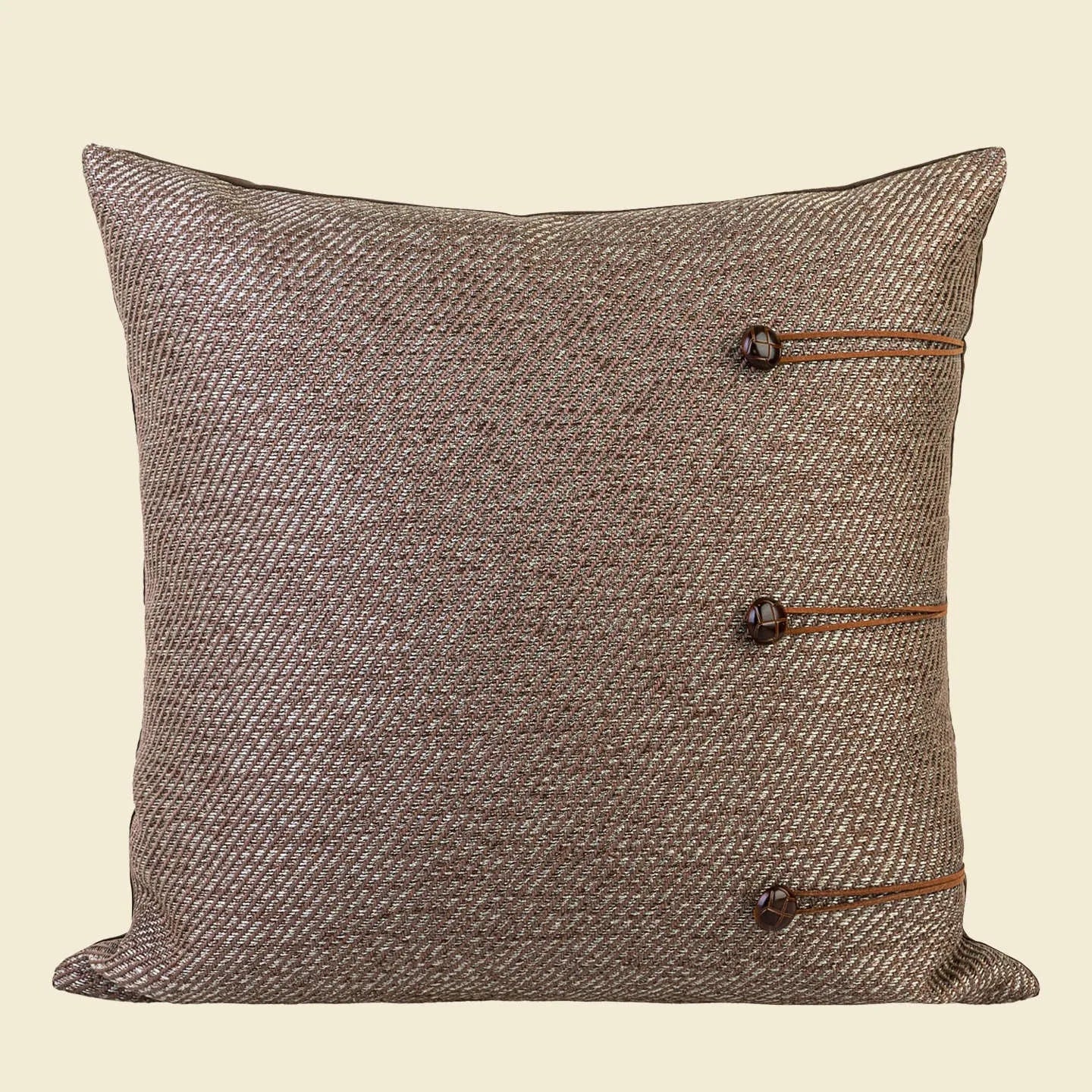 Chinese style square cushion in Maillard colour on a sofa, 45cm size with geometric pattern.