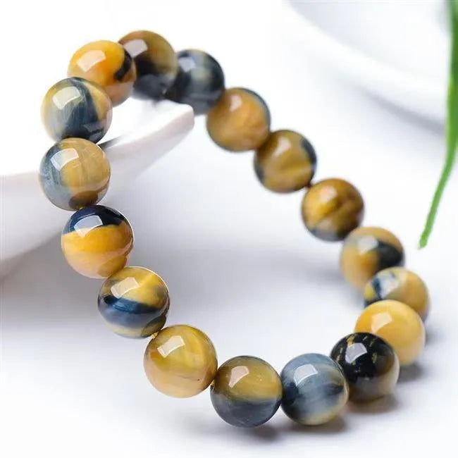 Fantasy tiger eye agate bracelet with geometric round beads in a unisex single circle design.