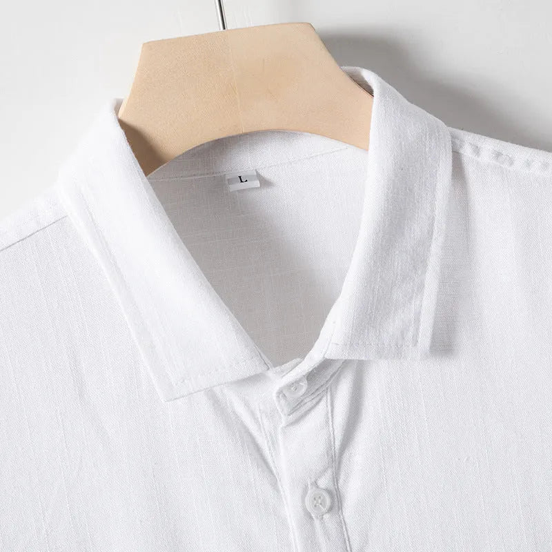 Man's loose-fit linen blend T-shirt in black, shown in a casual setting.