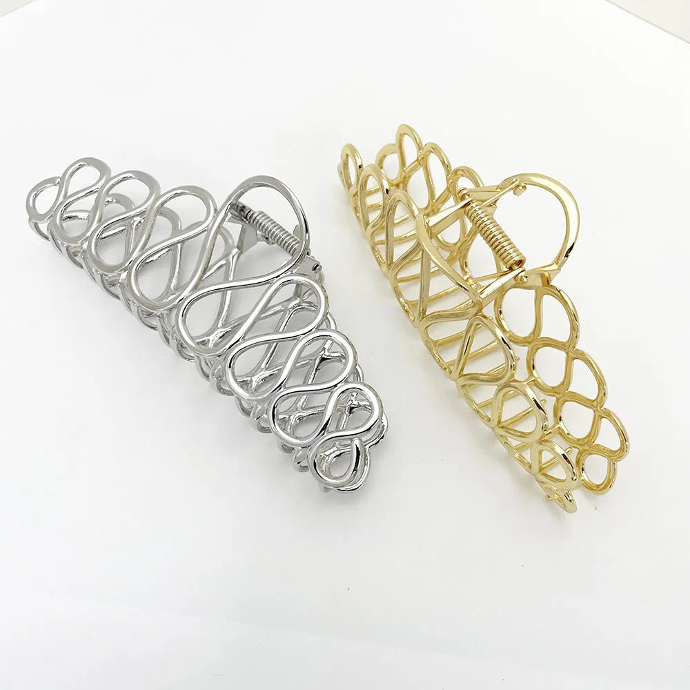 Large minimalist updo hair clip in gold or silver electroplated alloy with tassel details