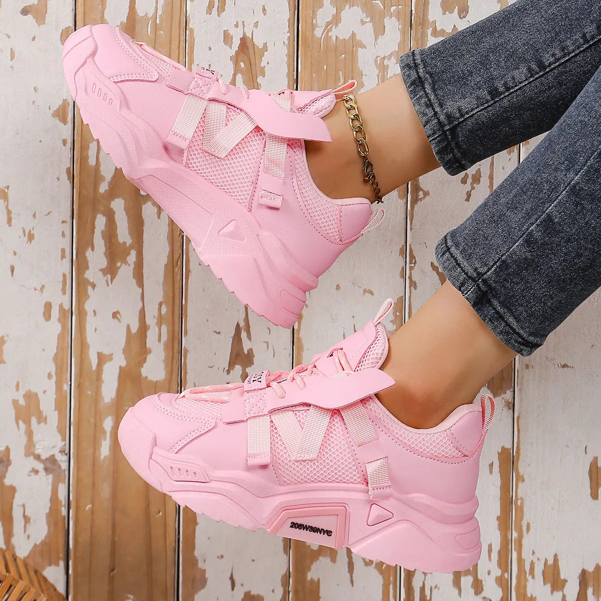 Women's purple platform mesh sports sneakers with animal pattern and lace-up front.