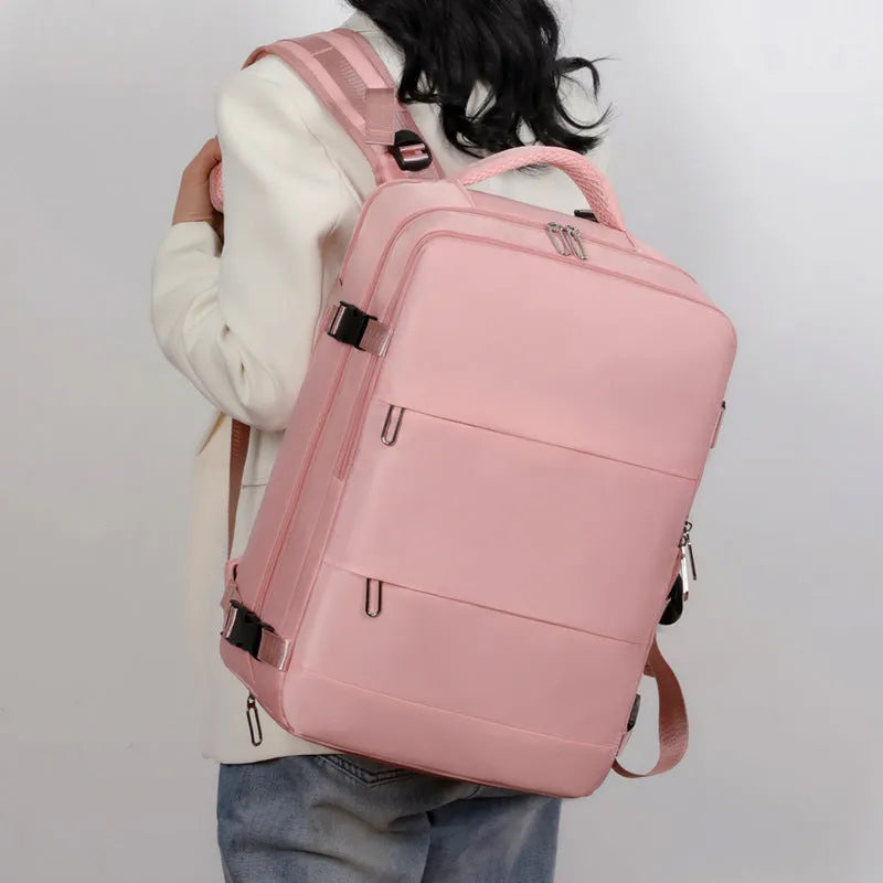 Large-capacity travel backpack in purple, grey, black, or pink with organised compartments and waterproof Oxford fabric
