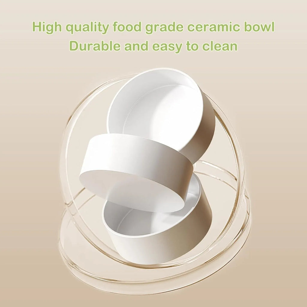 Green ceramic raised cat food and water bowls set with tilted stand on a kitchen floor.