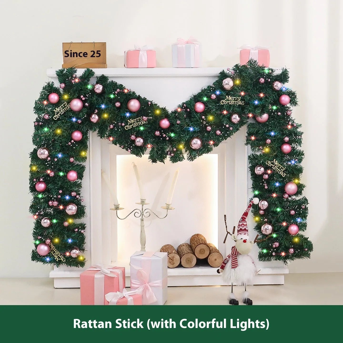 Pink artificial Christmas rattan vine garland with fairy lights draped on a mantelpiece