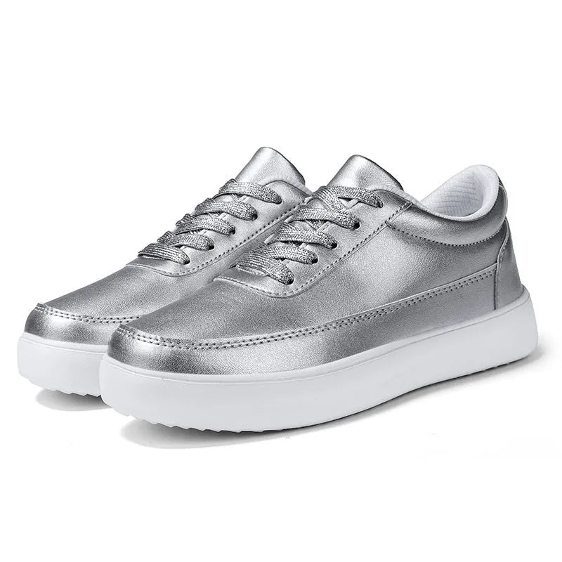 Women's white leather lace-up casual flat shoes on a neutral background.
