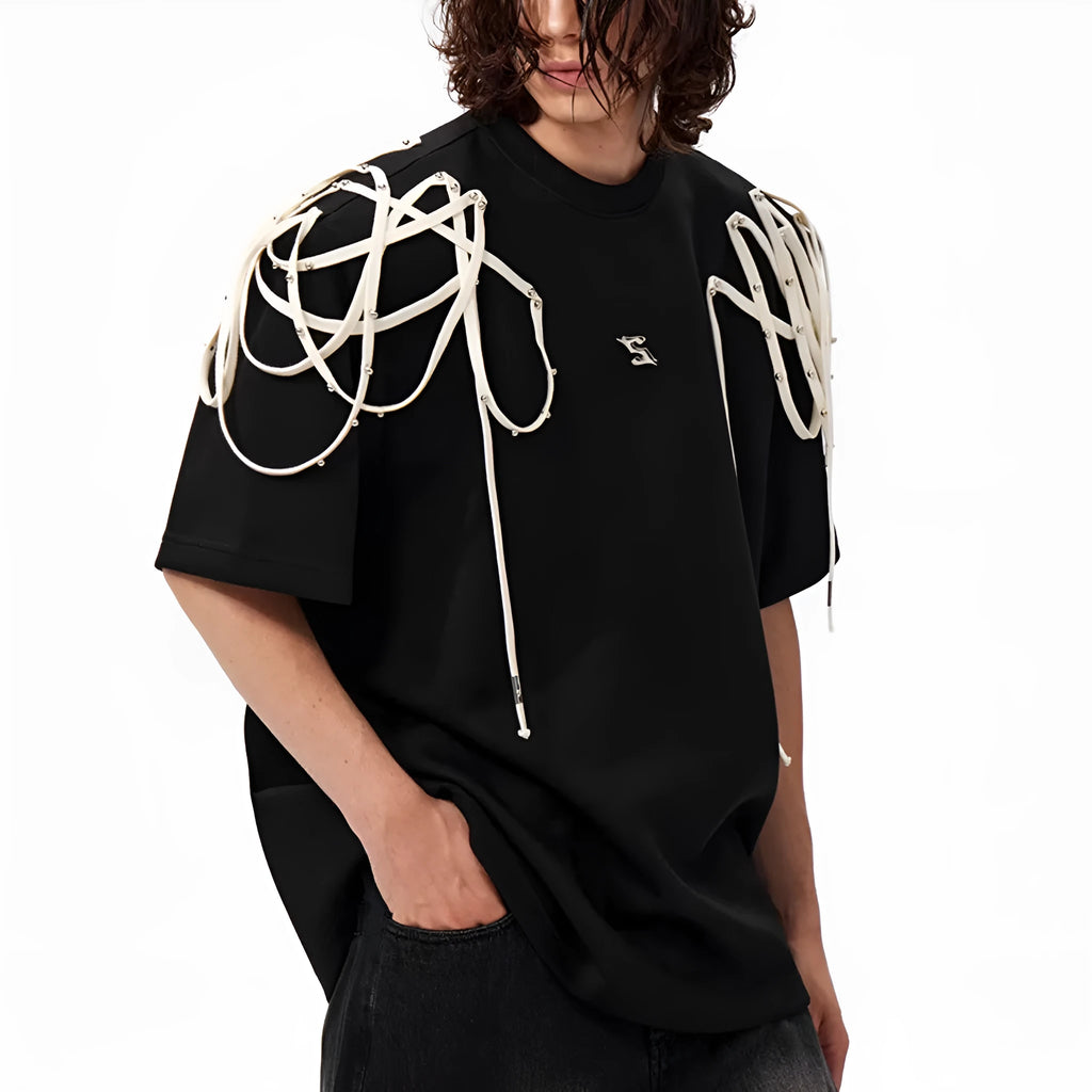 Black loose-fit short-sleeved t-shirt with padded shoulder detail and ribbed cotton texture.