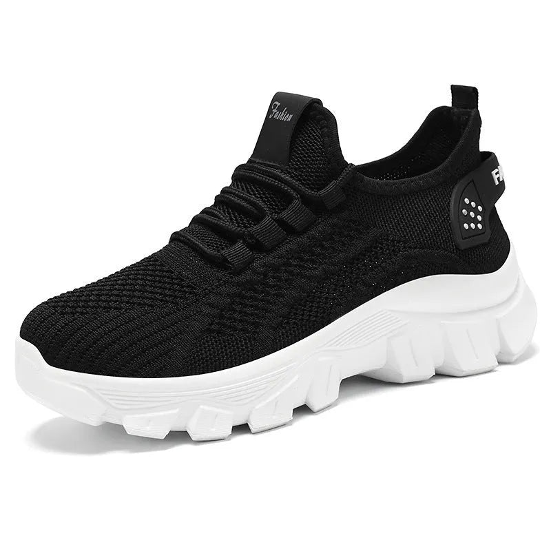 Women's white Flyknit running sneakers with thick PVC sole and lace-up front