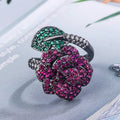 Black gold plated geometric floral ring with a red simulated corundum stone for women.