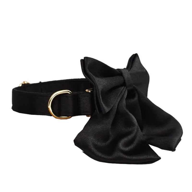 Cloth dog collar and leash set with matching decorative bow and dog vest on a size chart showing S, M, L, XL.