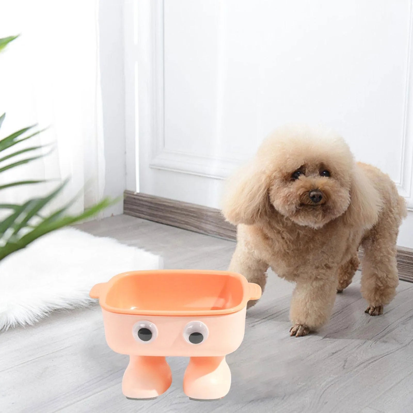 Green robot-shaped elevated cat bowl with tilted dish and anti-slip base.