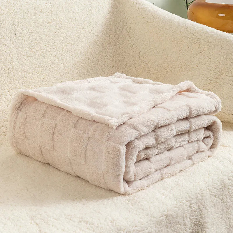 Geometric pattern polyester blanket in milky white colour showing thickened texture