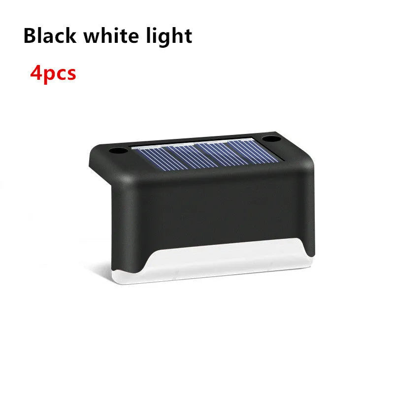 Solar garden stair light in black with warm light, compact ABS housing for outdoor courtyard use