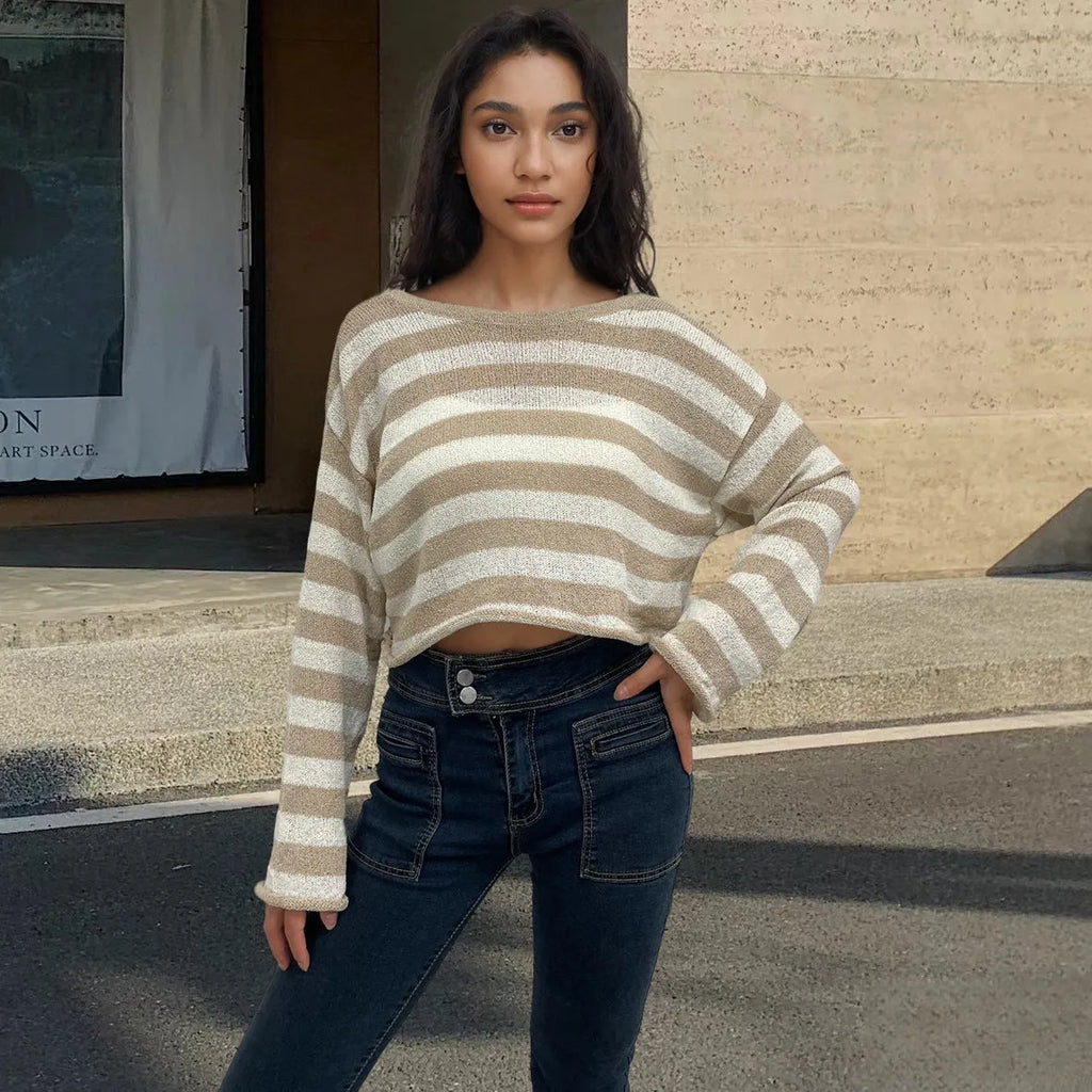 Striped long-sleeved cotton sweater with an exposed navel design on a model