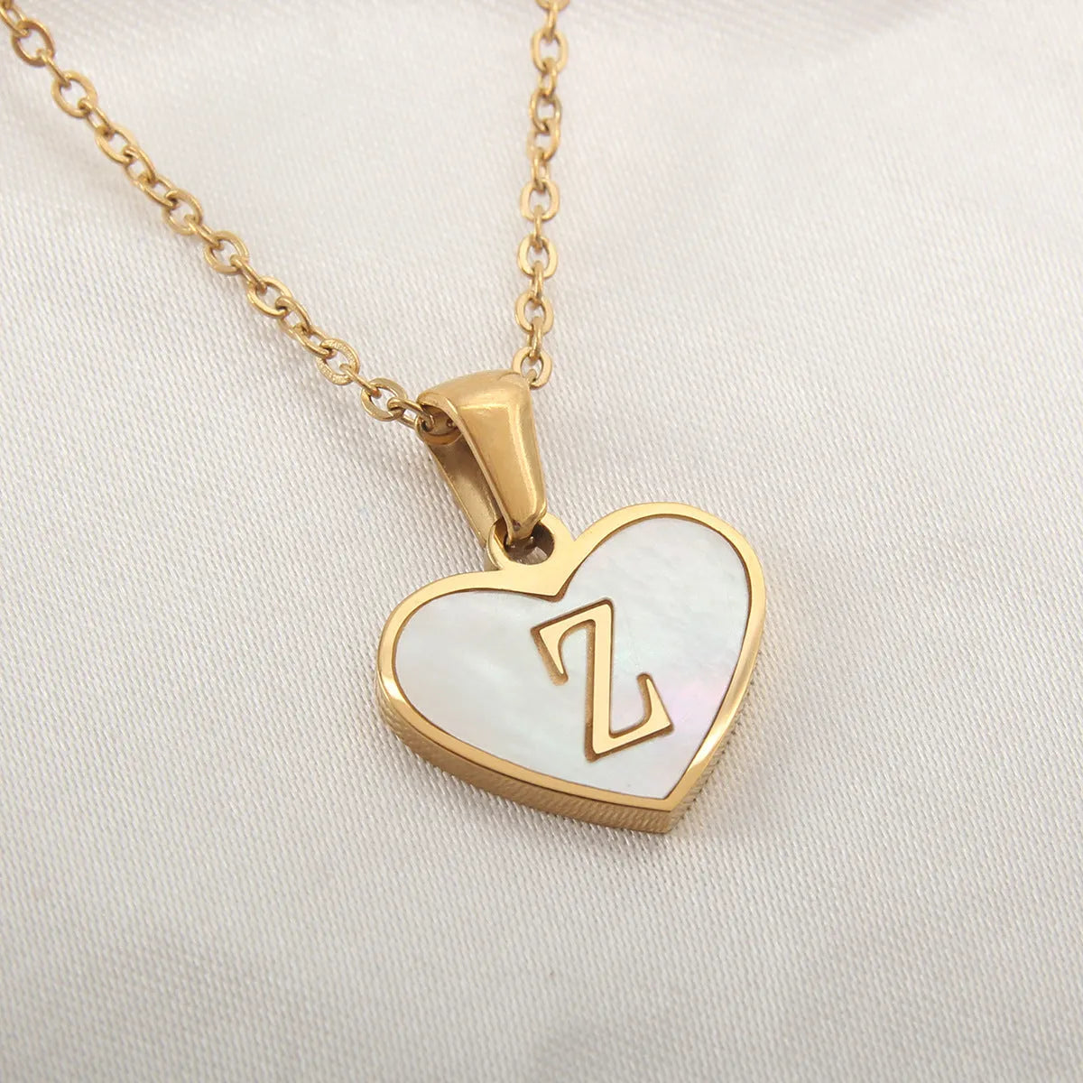 Gold plated personalised heart necklace with white shell on a 45cm chain