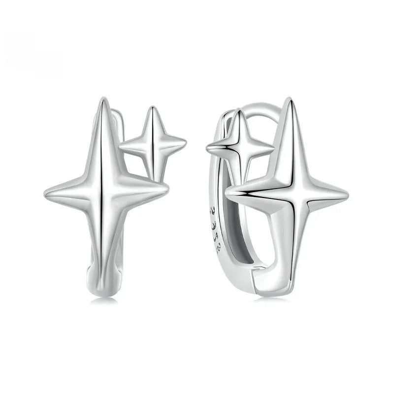 Minimalist star design ear clips in sterling silver with oxidised finish and XINGX elements