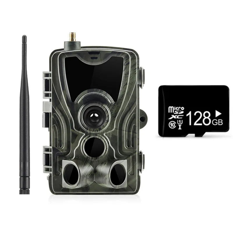 Outdoor camouflage surveillance camera with wide-angle lens on a green background.