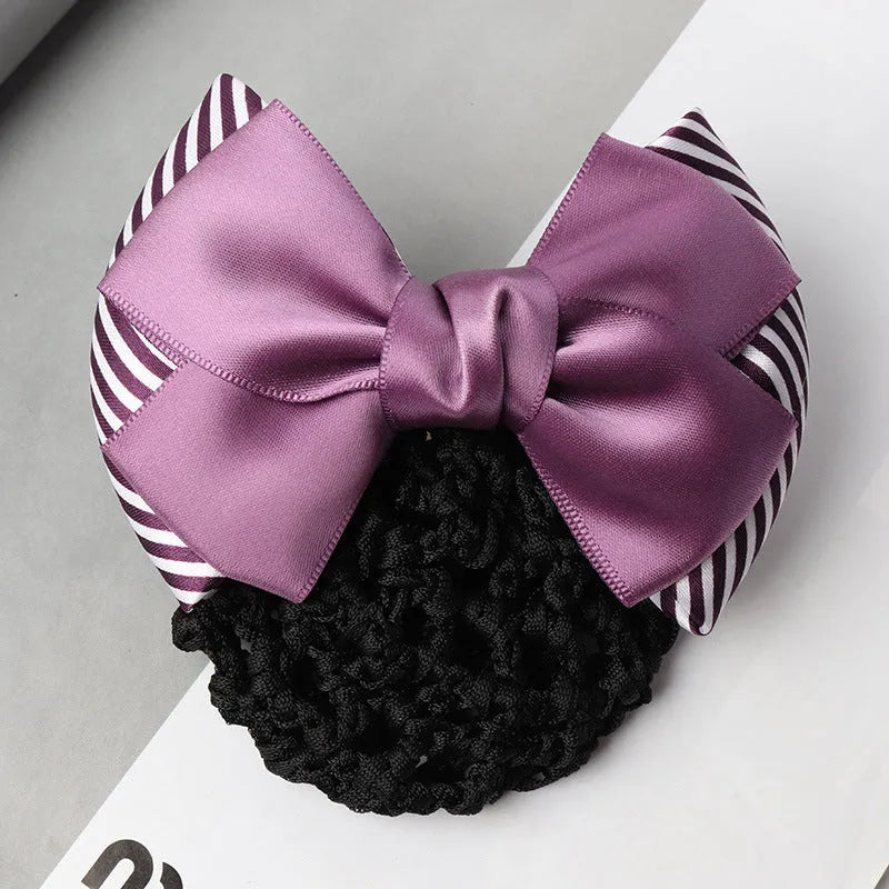 Professional hair clip with a black net pocket and a red flower bow ornament on a white background.