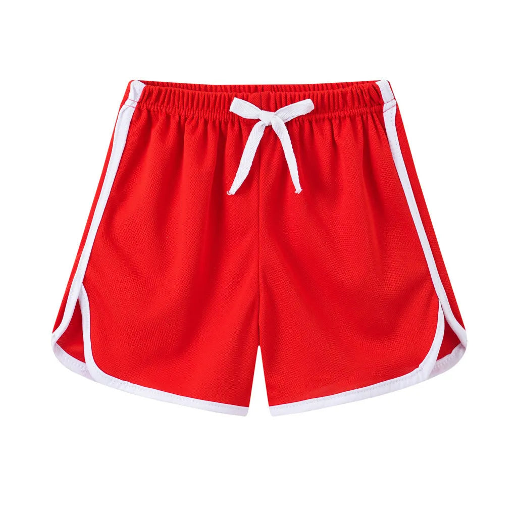 Children's polyester beach shorts in various colours and patterns including stripes, prints and solid options