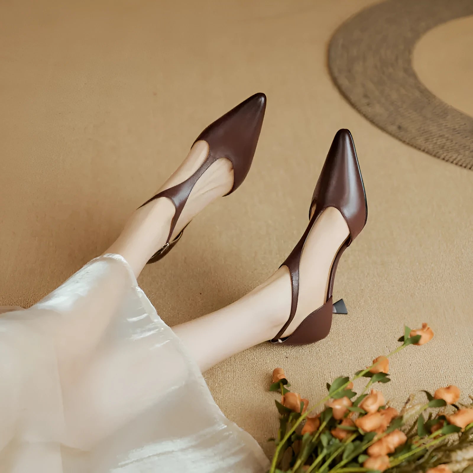 Women's black pointed toe high heels made from cowhide leather.