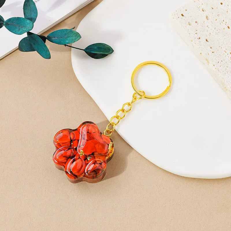 Small natural crystal cat's paw shaped pendant on a metal keyring, available in various crystal colours.