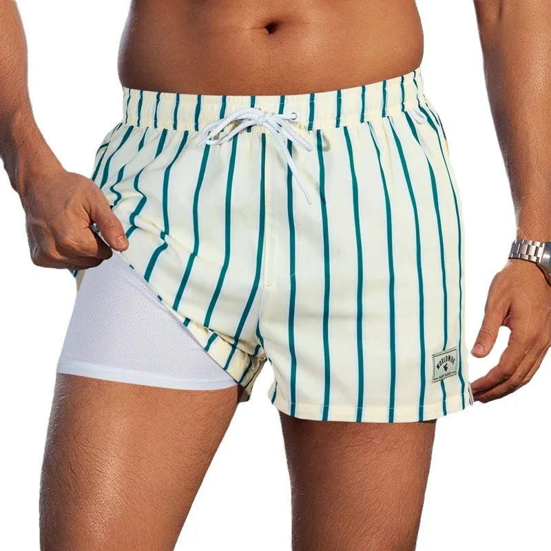 Men's loose swimming trunks with elastic waistband in multiple colour patterns including floral and aquatic designs