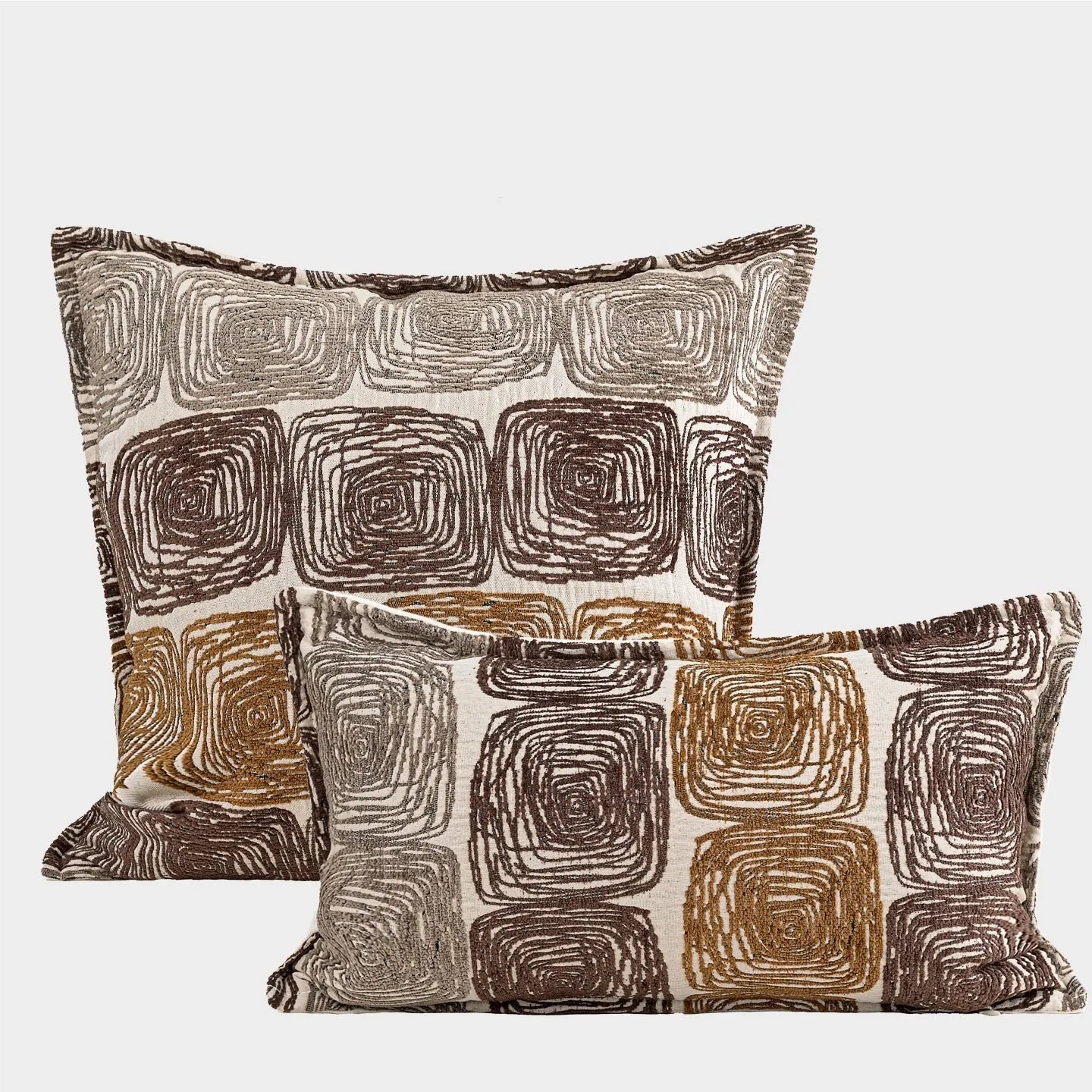 Square and rectangular pillow covers with abstract cream and coffee coil pattern on polyester fabric.