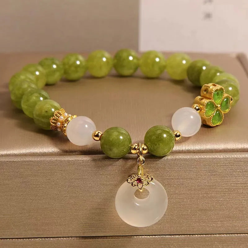 Natural stone green tourmaline women's bracelet with four-leaf clover charm and safety buckle closure