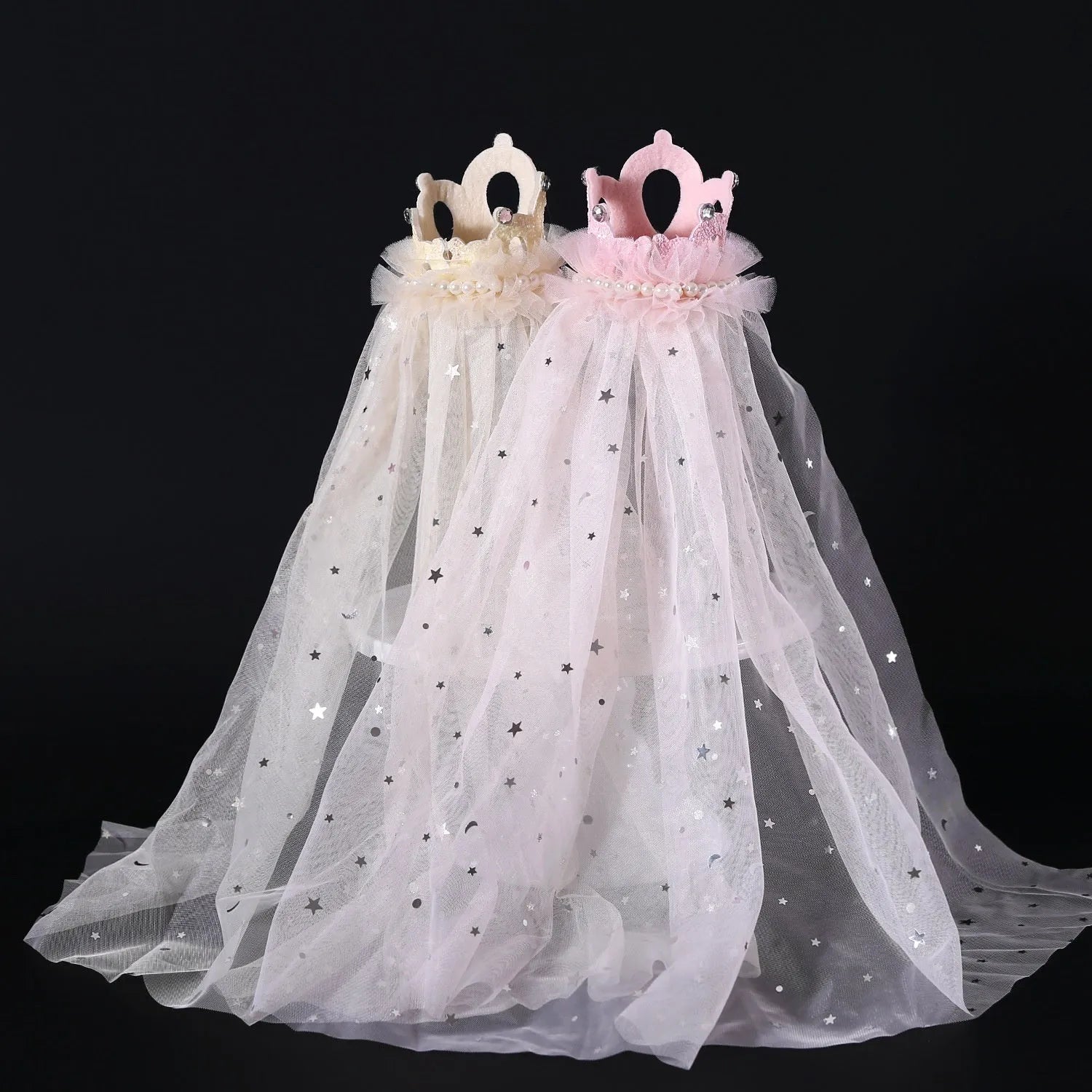 Cat wearing a princess crown headdress with a long, flowing veil in beige or pink colour.