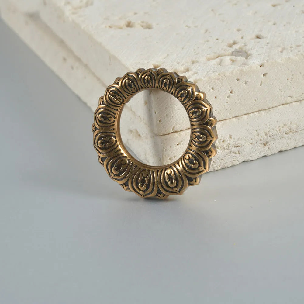 Retro heart-shaped hollow lotus magnetic earrings in stainless steel with antique silver finish