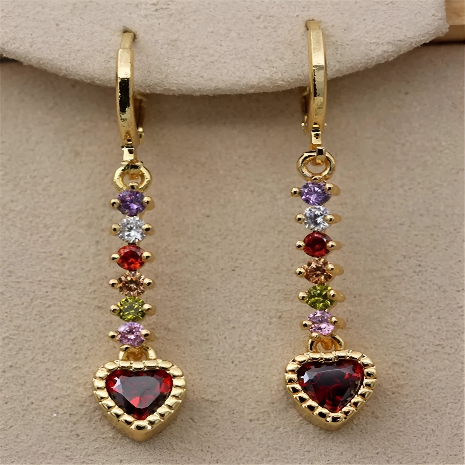 A pair of women's heart-shaped alloy earrings in gold or silver electroplated finish.
