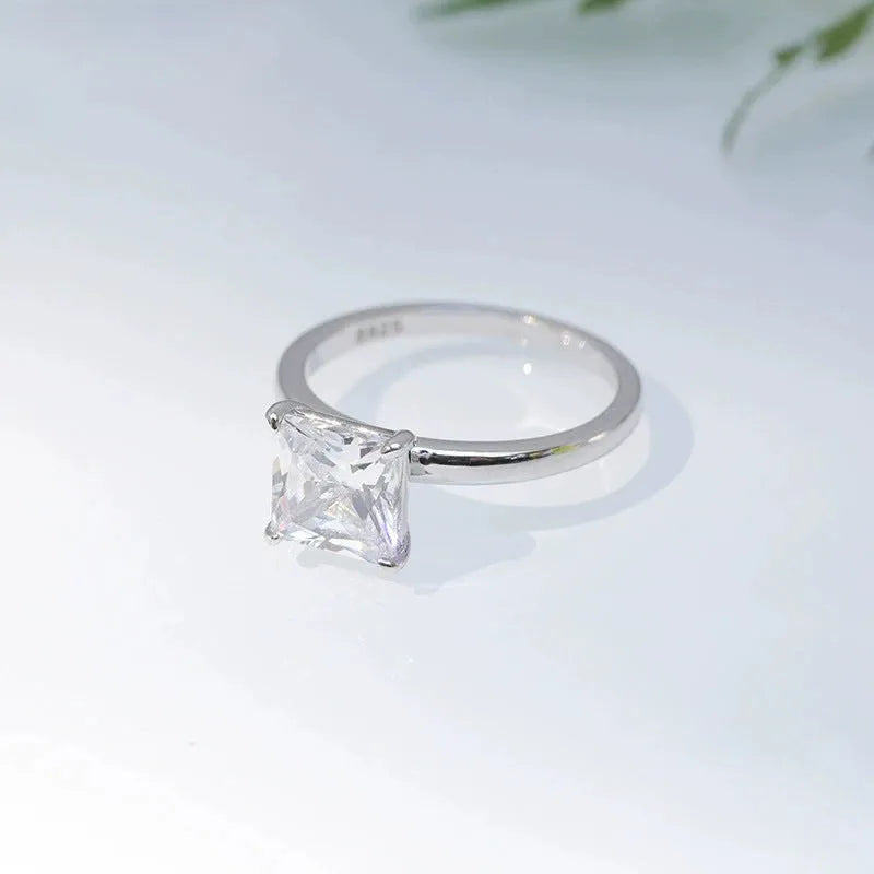 Polished 925 silver geometric simple ring for women on a white background.