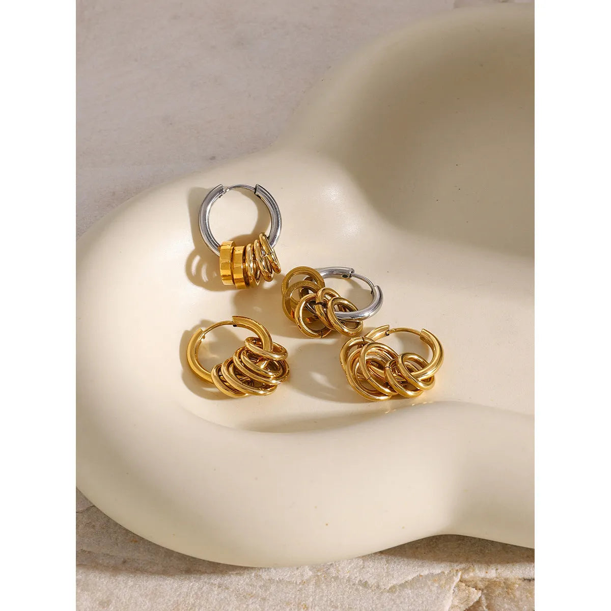 Stainless steel ins style earrings with electroplated finish in JDE2405019 colour.