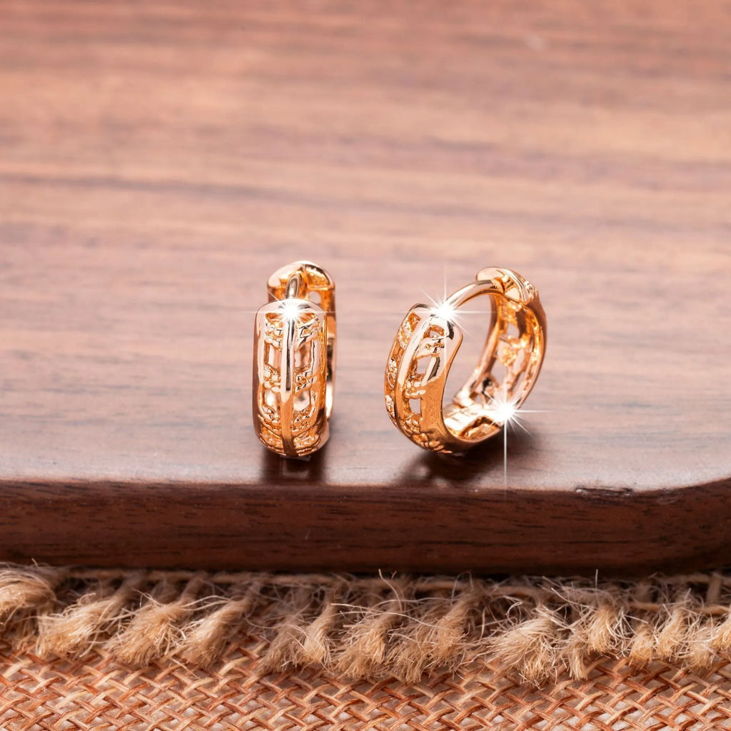 Copper rose gold hollowed-out leaf earrings with heart-shaped details